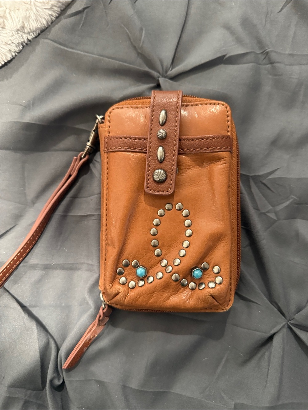 The Sak Brown Leather Studded Wristlet with Turquoise Accents